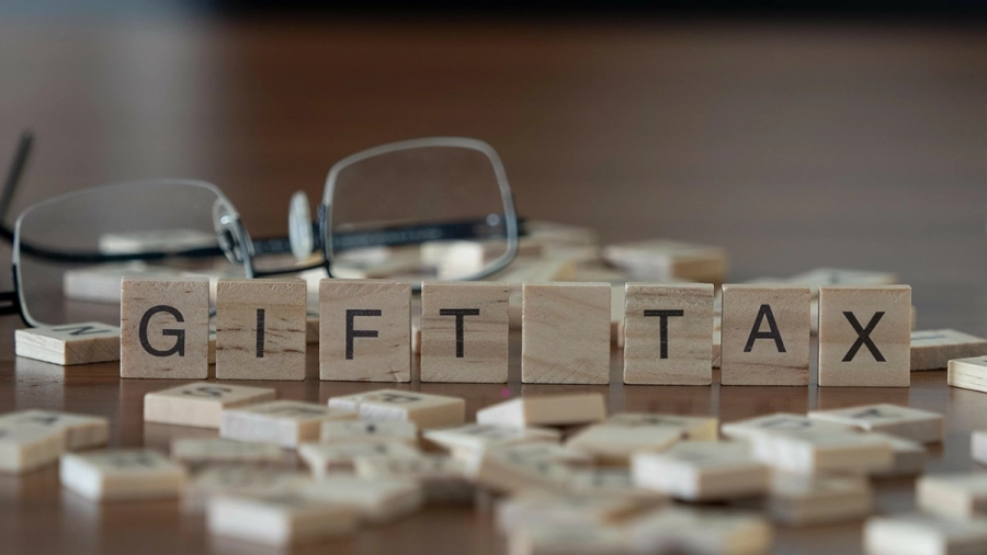 Scrabble letters spelling out the words gift tax