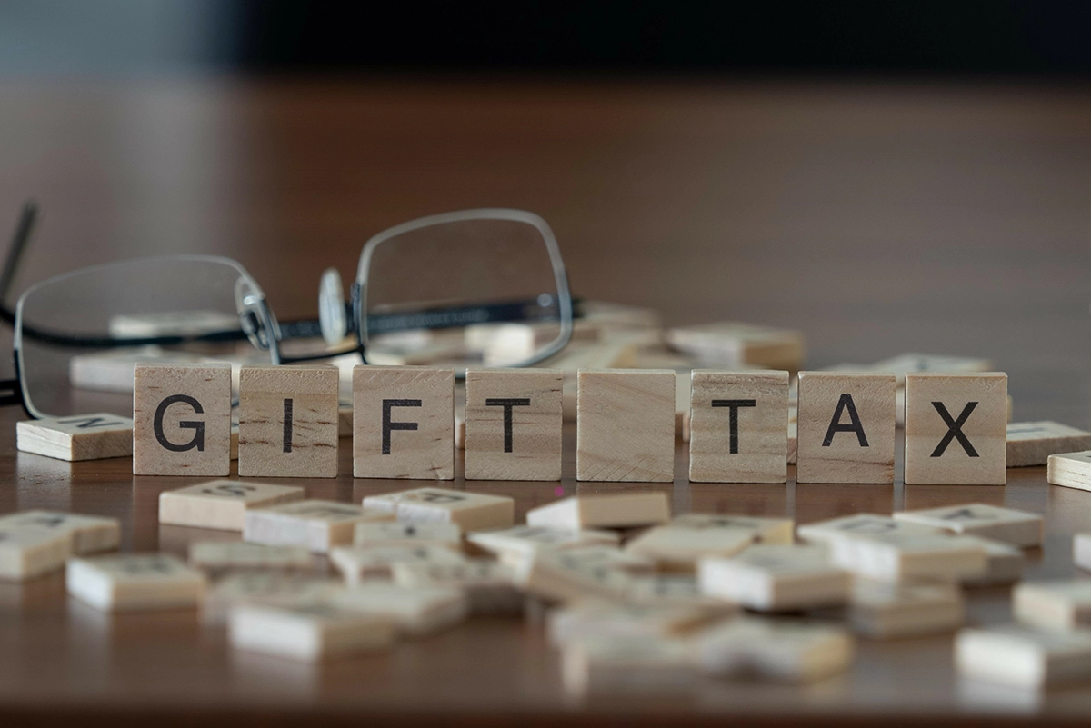 Scrabble letters spelling out the words gift tax