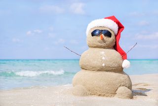 Bigstock-Smiling-Sandy-Snowman-In-Red-S-72707647